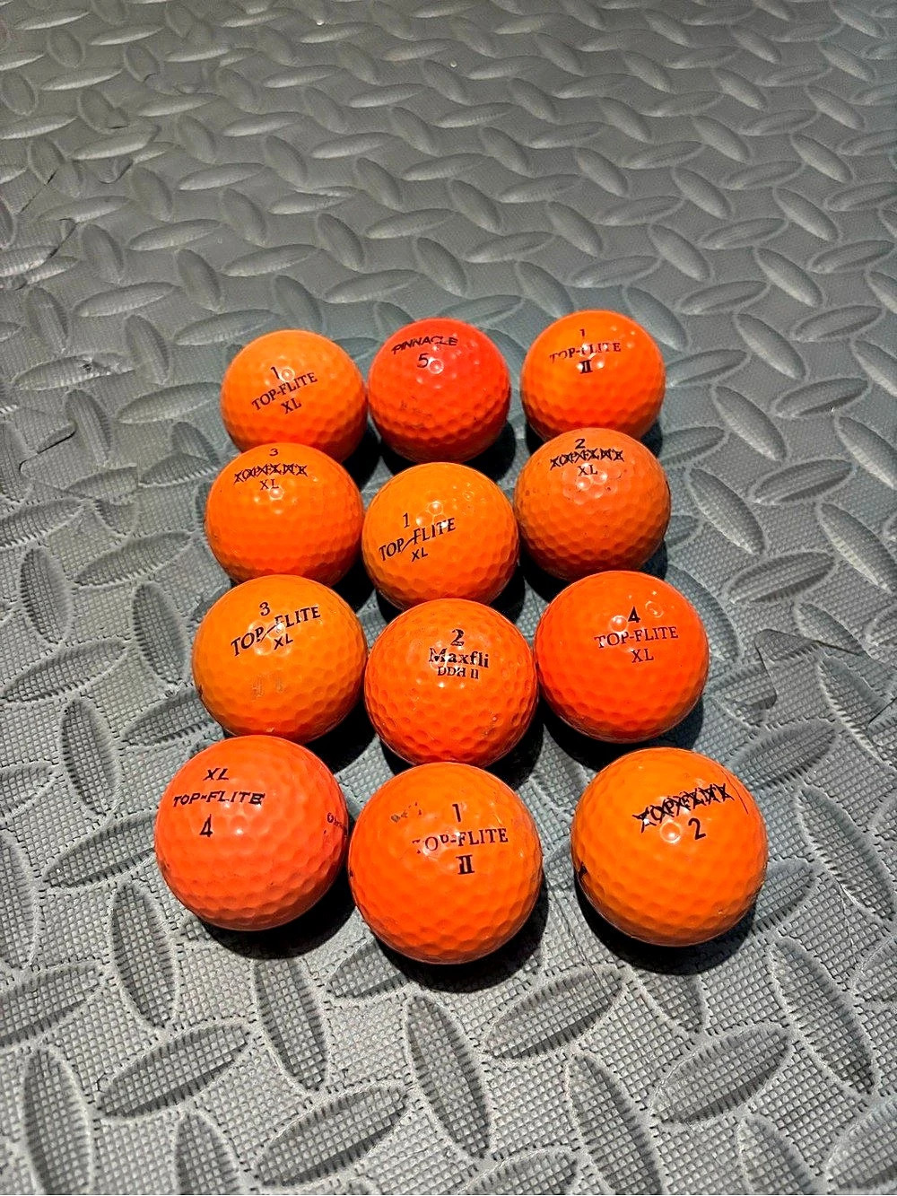 One Dozen Assorted Orange Golf Balls